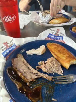 Split plate of pork and brisket. Restaurant happily split it for us