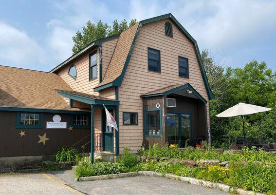 The cafe is on the right and is attached to an indoor New England Goods shopping "consortium".