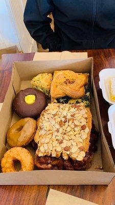 Old fashioned, maple old fashioned, spinach scones, almond bear claws, custard filled chocolate donut, spinach focaccia