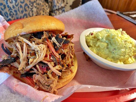 Pulled Pork sandwich with picnic potato salad. Side was awesome as well and had a mustard taste.