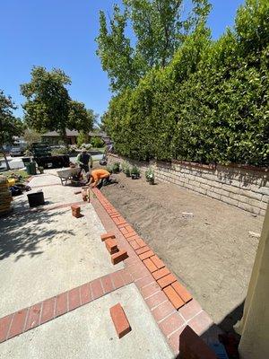 Driveway- Added a row of bricks and landscape