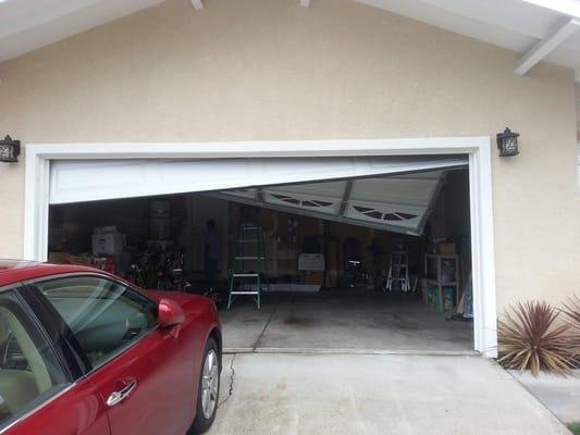 Off Track garage door repair. We were able to repair this door. In Union City CA.