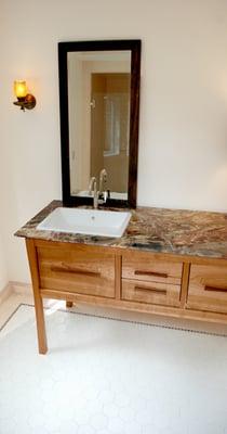 The Ms. Bath vanity, constructed by Molly Cherney of The Seamstress and the Carpenter, the Breccia supplied and fabricated by Allied Marble.