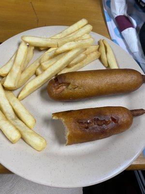 White fries and burnt corn dog.