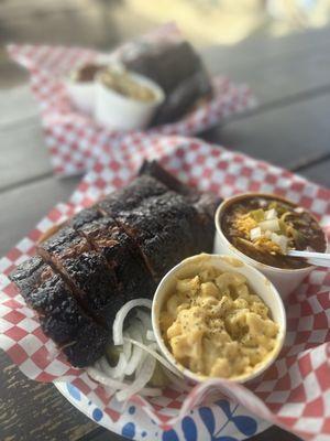 Half slab ribs with a side of mac n cheese and brisket chili