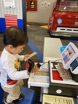 My son with checkout counter 2