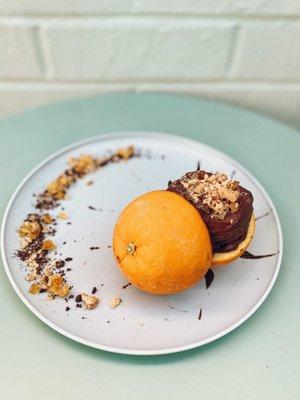 Dark chocolate sorbetto, with Italian cookies, and peeled oranges. Flavor presented at the Gelato Festival in LA