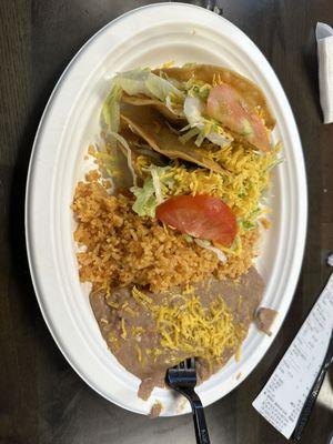 hard shell tacos with shredded beef rice and beans