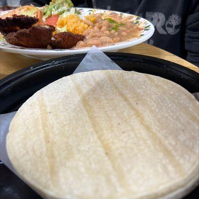 Burnt fish and old stale tortillas