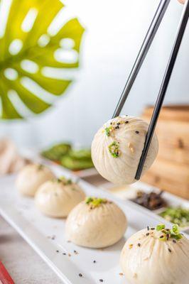 Our Q-Bao are tasty buns filled with moist pork and wrapped with half fluffy, half crispy dough.