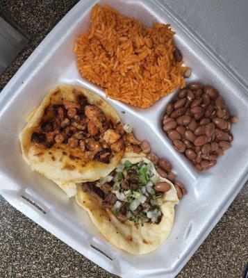 Carne Asada and Al Pastor Tacos with beans/rice