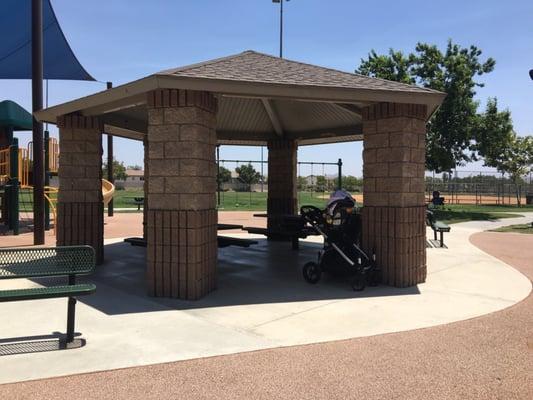 Gazebo with 2 tables under