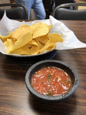 Complimentary chips and salsa. Bright and fresh flavors.