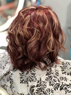 Beautiful cut and color on the fried and orange hair