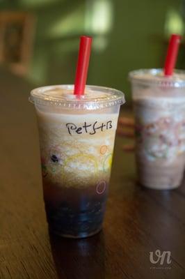 Peach slush with boba with chocolate milk slush with rainbow jelly in the back (for the kiddo)