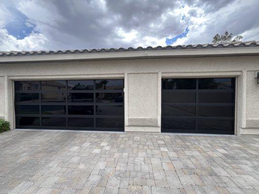 Brand new full-view doors installed. Black frames and tinted glass shown.