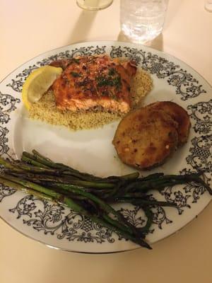 Grilled salmon on couscous with fried zucchini and grilled asparagus