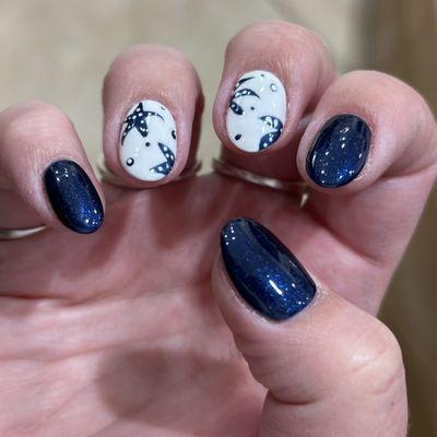 Navy and white nails with navy starfish and bubble designs