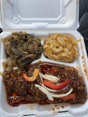 Great flavor  Oxtail Oxtail Platter with Mac & Cheeseamd Greens and Cabbage Mix