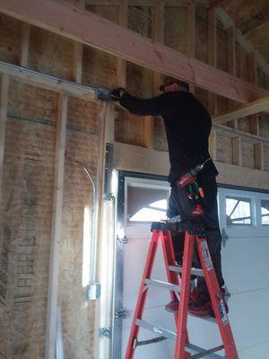 Licensed electrical technician installing conduit.