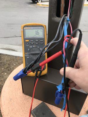 Measuring light pole voltage for a customer