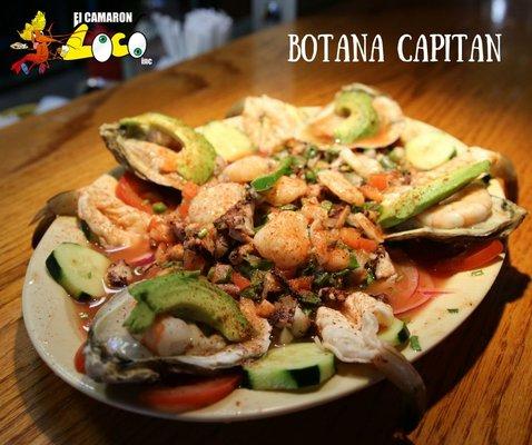 Botana Capitan - a delicious seafood bed. With shrimp, oysters, octopus & more.