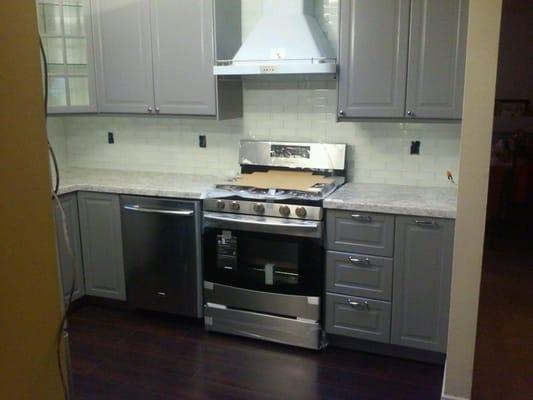 New flooring, granite counters, IKEA cabinets, appliances & back splash to liven up kitchen