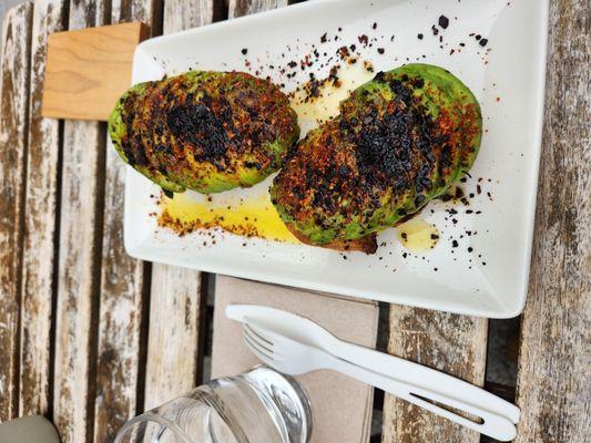 Avocado toast - $12 Two chunky slices of toast with about a whole avocado on top + chili crisp oil.