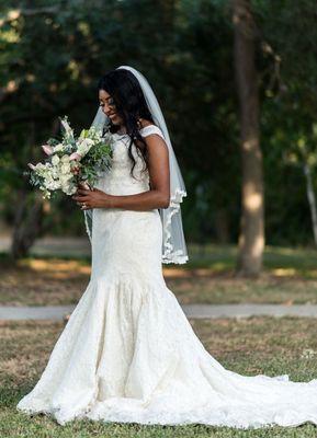 A bride holding a bouquet of flowers