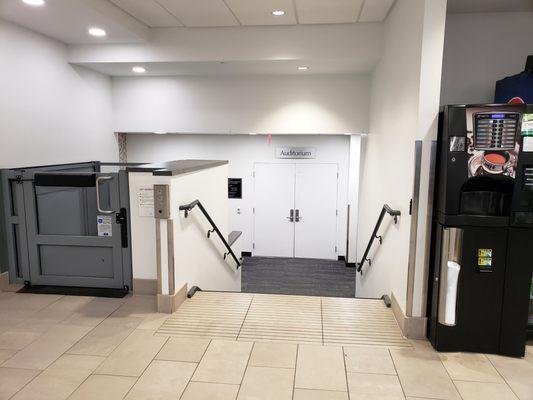 Entrance to the auditorium.  Lift with an open-top on the left side.