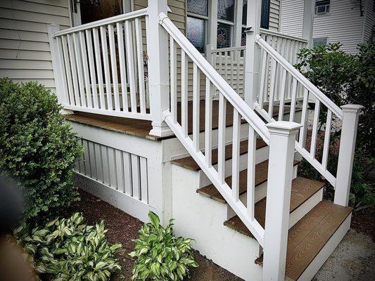 Front entry composite, vinyl and azek porch and staircase build.