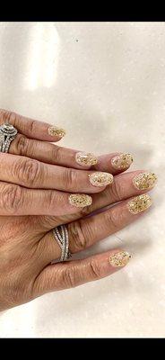 Dipped gold flake powder over one layer of pearl glitter powder. Natural nail with slight coffin shape. Nail Technician: Angel