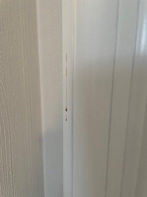 Blood drip on closet door trim.