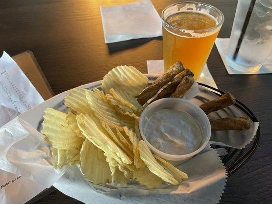 Solid onion dip with pretzels and chips, goes well with beer