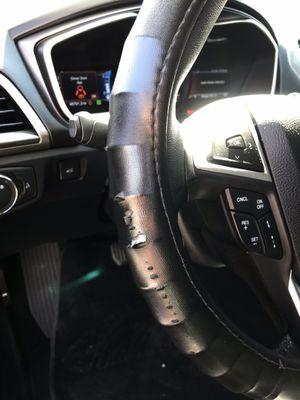 Torn steering wheel cover