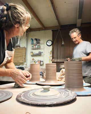 Owners and potters, John Foelber and Judy Adams, working in the studio