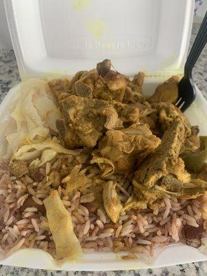 Curry Chicken, rice with peas and steamed cabbage.