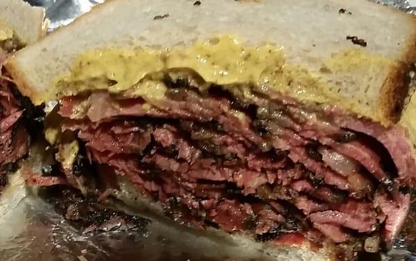 Warm pastrami on rye with spicy mustard