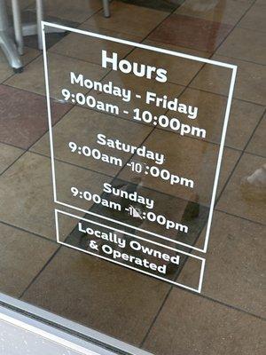 Hours printed directly on the door. Saturday  9:00am-10:00pm