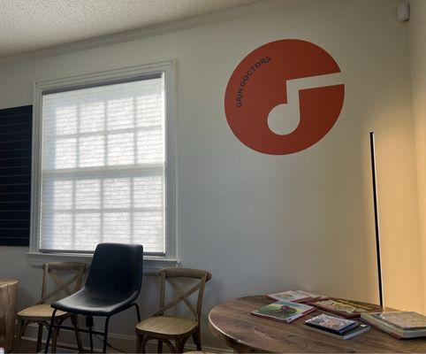 Waiting area has tables with books for kids