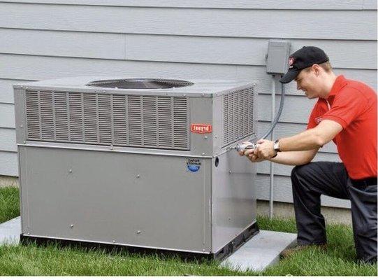 John working on a Bryant heat pump package unit in Mount Pleasant, SC