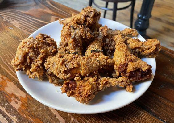 A dozen fried quail legs