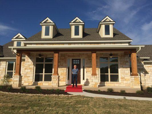 Another happy client outside his new home!