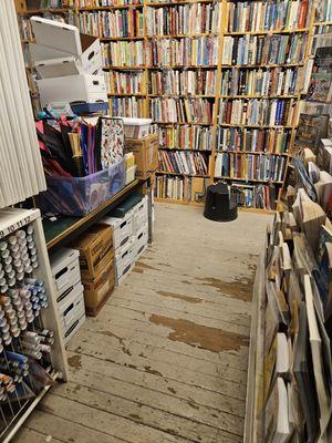 Aile ending in a wall of books