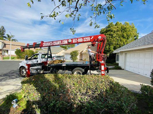 Crane used to move spa