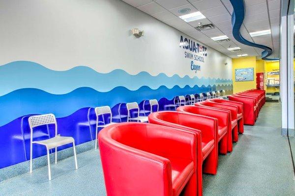 Big red chairs in pool room lobby