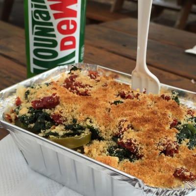 A regular with spinach, sundried tomatoes, and jalapenos topped with bread crumbs.