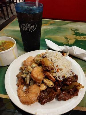 Fried shrimp, vermicelli, mussels,fried chicken wing,pepper steak,egg drop soup,and pepsi.