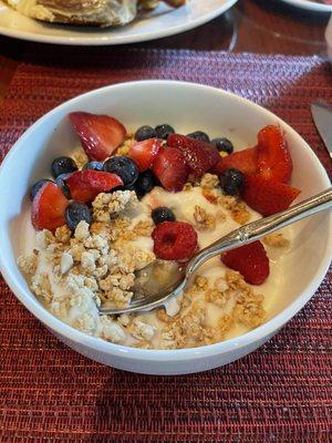 Parfait with granola, blueberries, strawberries and raspberries