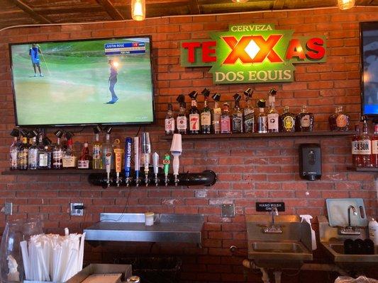 Two TVs at the bar